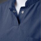 A close up photo of a fashionable blue collared scrub on a mannequin.