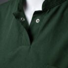 A stylish green collared scrub on a mannequin close up view.