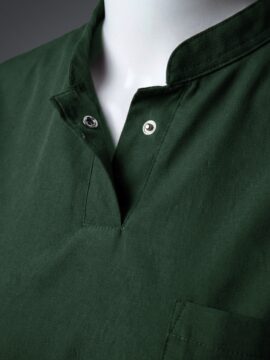 A stylish green collared scrub on a mannequin close up view.
