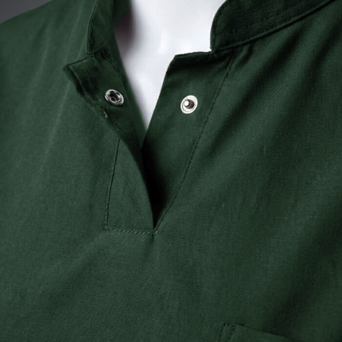A stylish green collared scrub on a mannequin close up view.