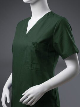 A close up photo of a fashionable green Pocketed scrub on a mannequin.