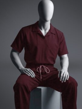 A stylish maroon t shirt scrub view on a sitting mannequin
