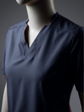 A close up photo of a blue fashionable V-neck design scrub on a mannequin.