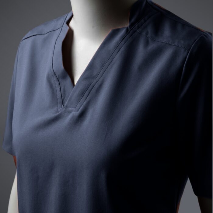 A close up photo of a blue fashionable V-neck design scrub on a mannequin.