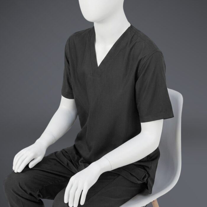 Black V neck scrubs sitting - 12 A stylish black minimal scrub with on a sitting mannequin.