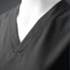 A close up photo of a fashionable black minimal scrub on a mannequin.
