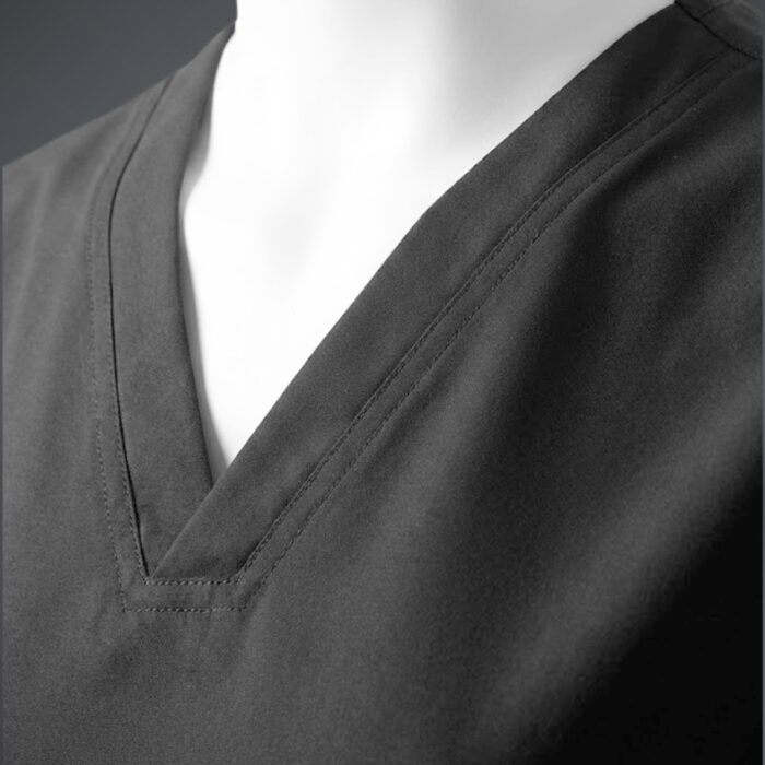Black neck scrubs close up A close up photo of a fashionable black minimal scrub on a mannequin.